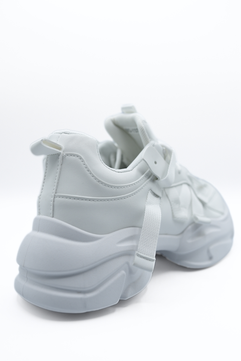 White lace-up platform chunky trainers, close-up of heel and outsole