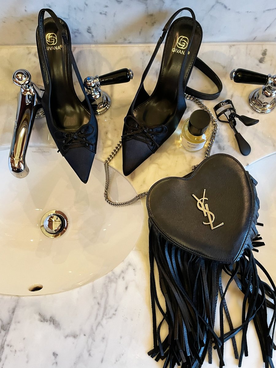 Sling back high heels in dark color with pointed toe and bow-knot detail
