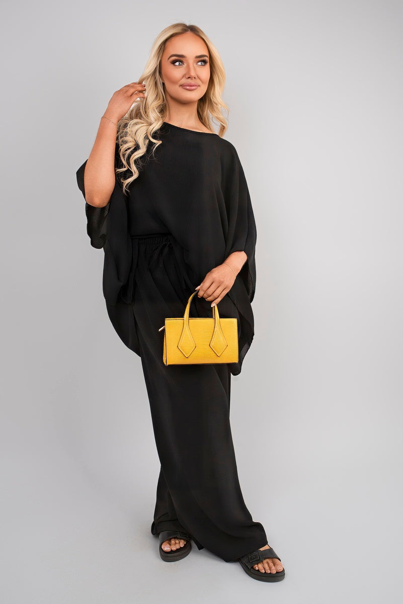 Black batwing top and drawstring wide-leg trousers co-ord set with cuffed sleeves.