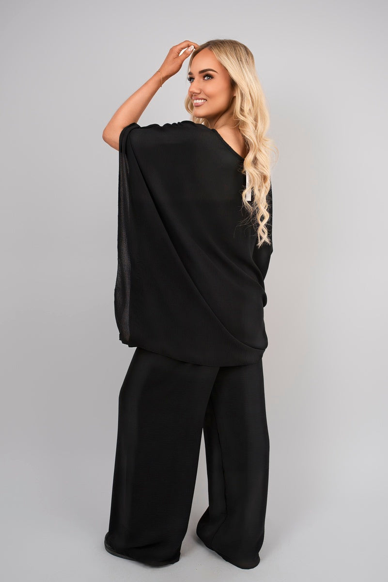 Black batwing top and drawstring wide-leg trousers co-ord set, relaxed drape.
