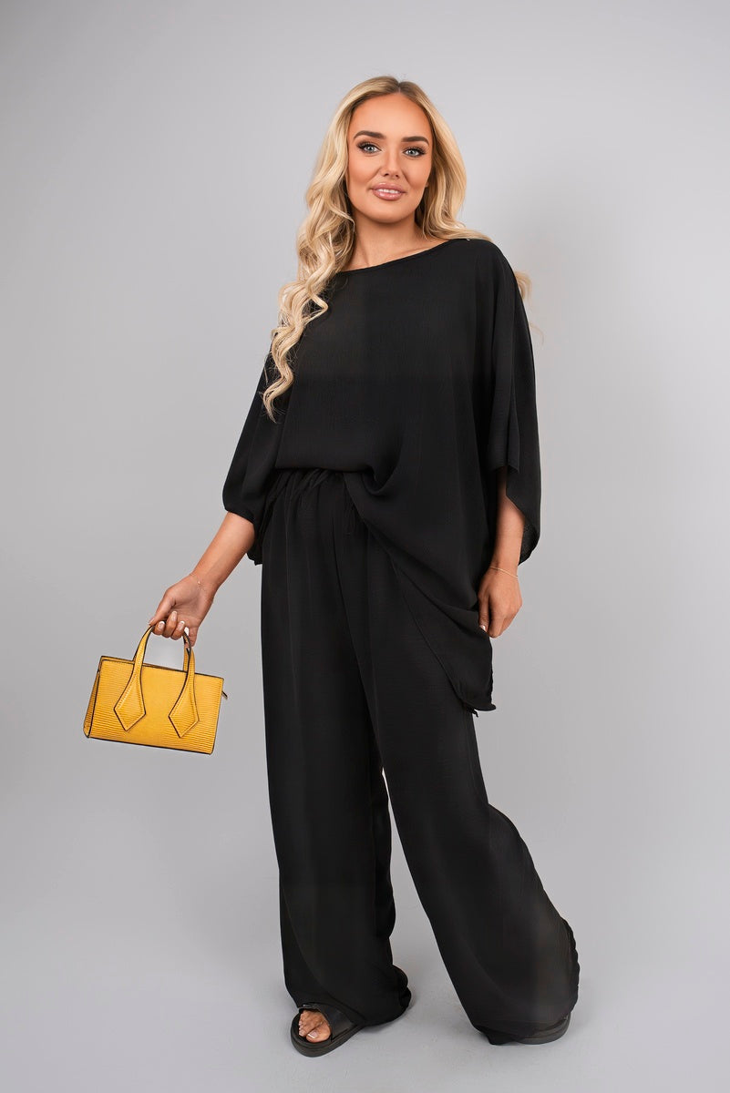 Black batwing top and drawstring wide-leg trousers co-ord set, loose drape and wide legs