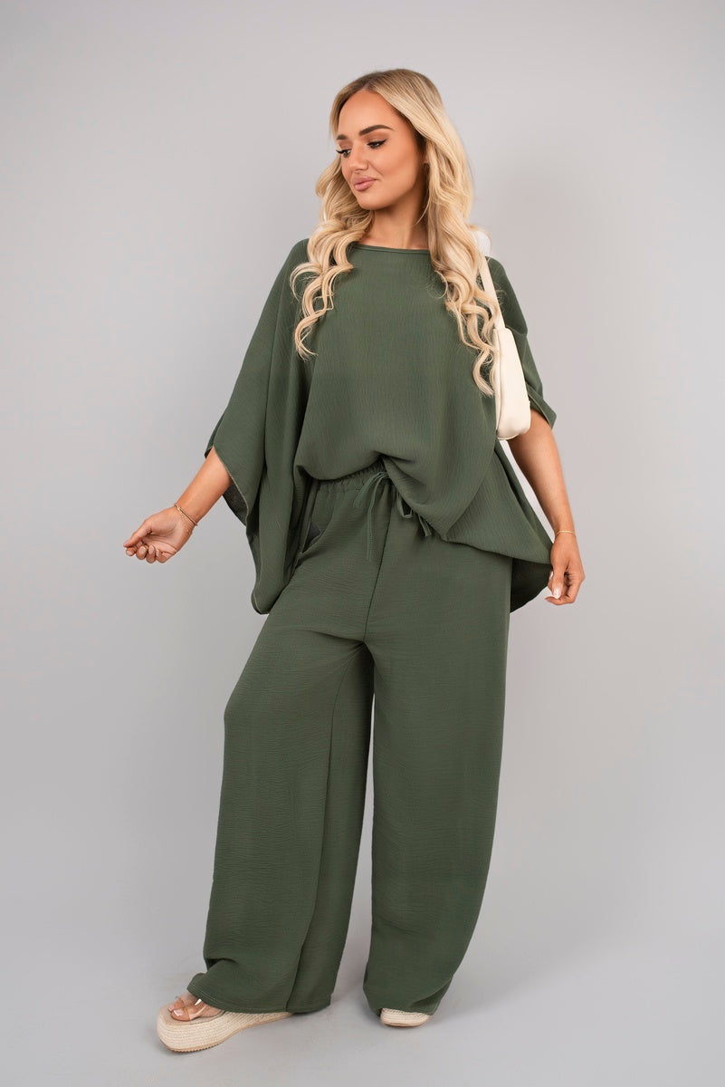 Green batwing top and drawstring wide-leg trousers co-ord set with gathered waist.