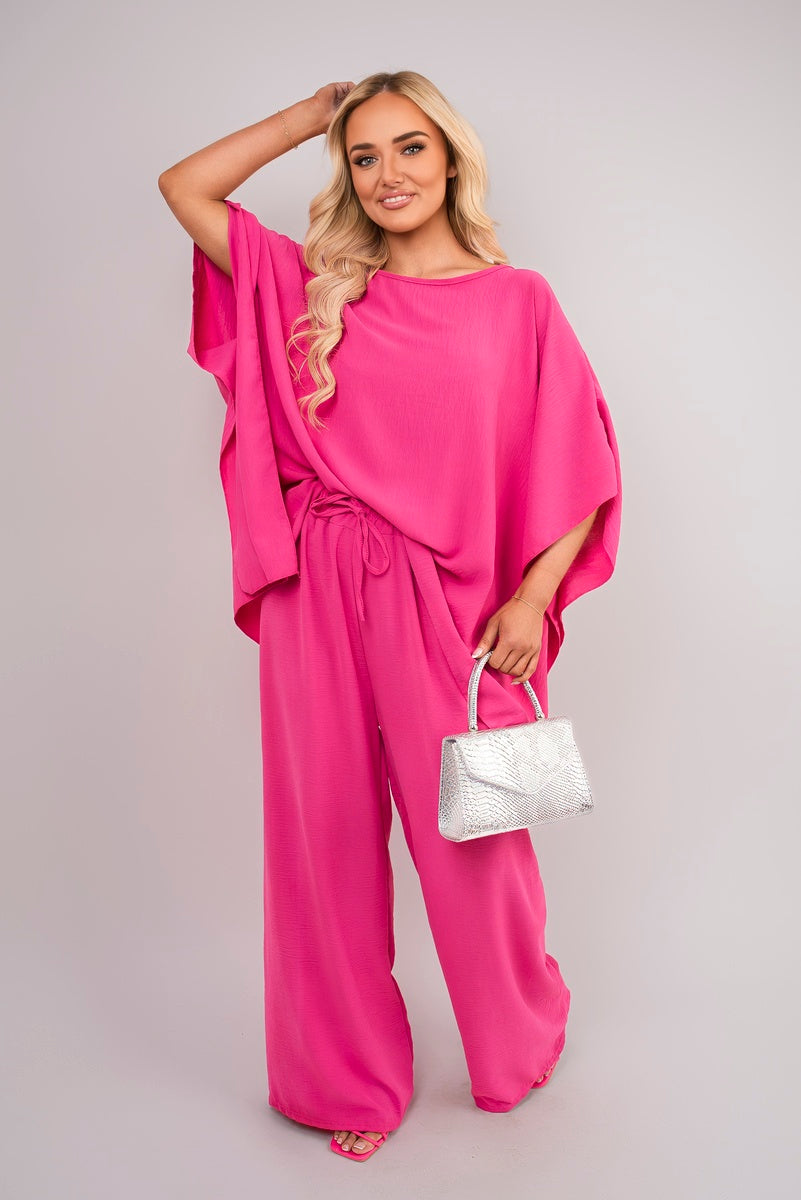 Fuchsia batwing top and wide-leg trousers co-ord set with drawstring waist, draped
