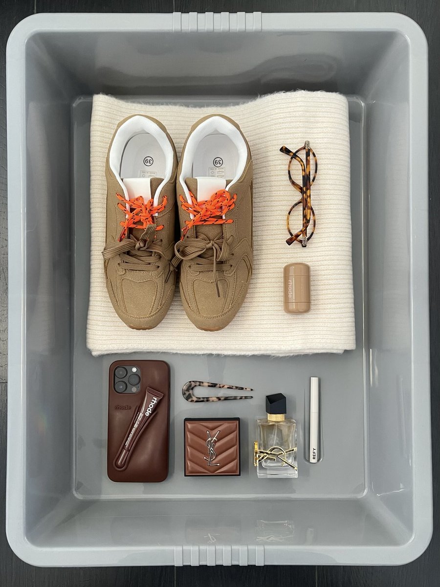 Camel lace-up flat trainers with orange laces, shown as a pair