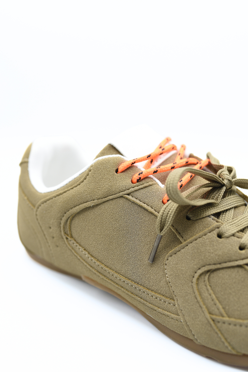 Olive lace-up flat trainer with orange laces, close-up of toe and side