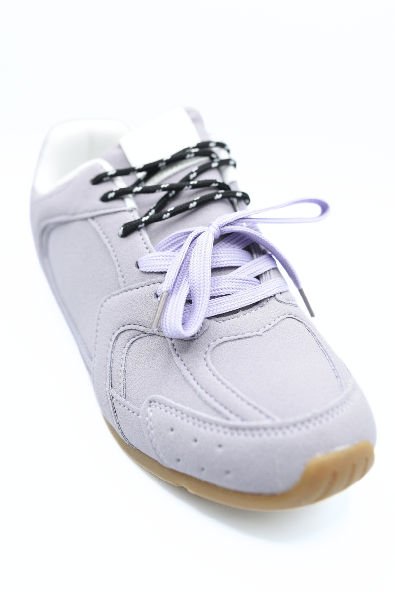 Lilac lace-up flat trainers with black lace and purple-tinted laces, gum sole