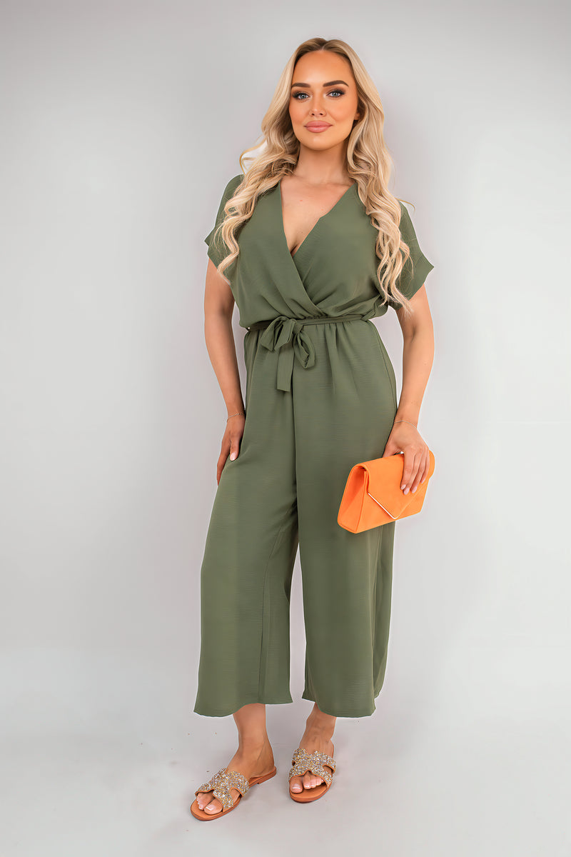 Olive wrap jumpsuit with short sleeves, tie waist, and wide cropped legs