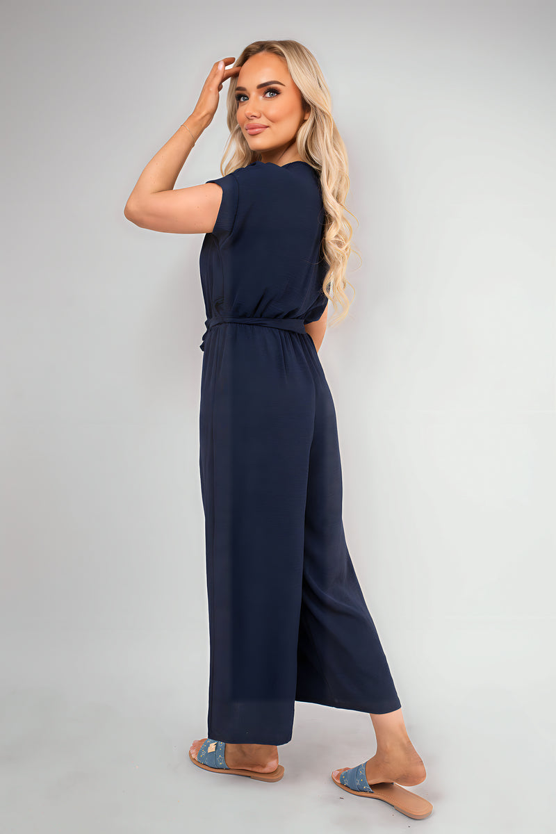 Navy wrap short-sleeve jumpsuit with tie waist and wide-leg pants