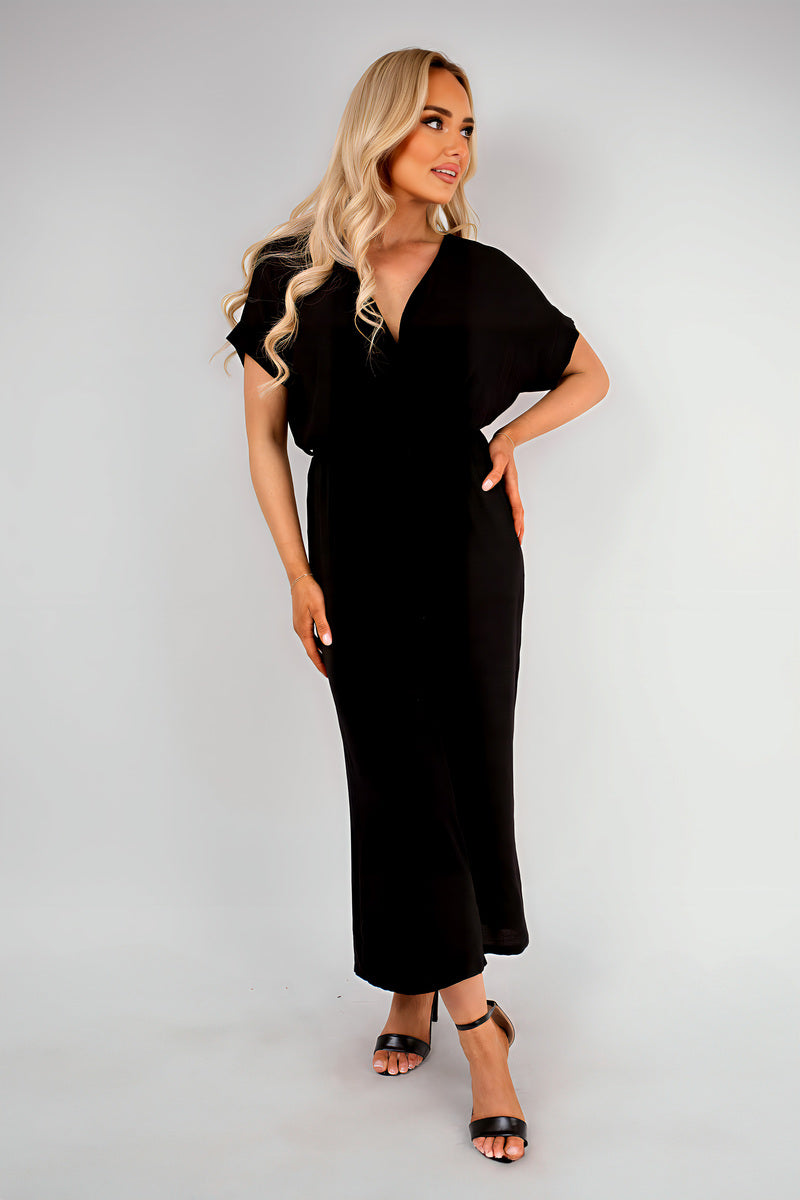 Black wrap V-neck jumpsuit with tie waist, short sleeves, wide-leg ankle length