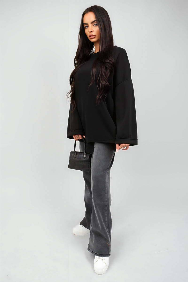 Black oversized long-sleeve sweatshirt with loose straight cut and round neck
