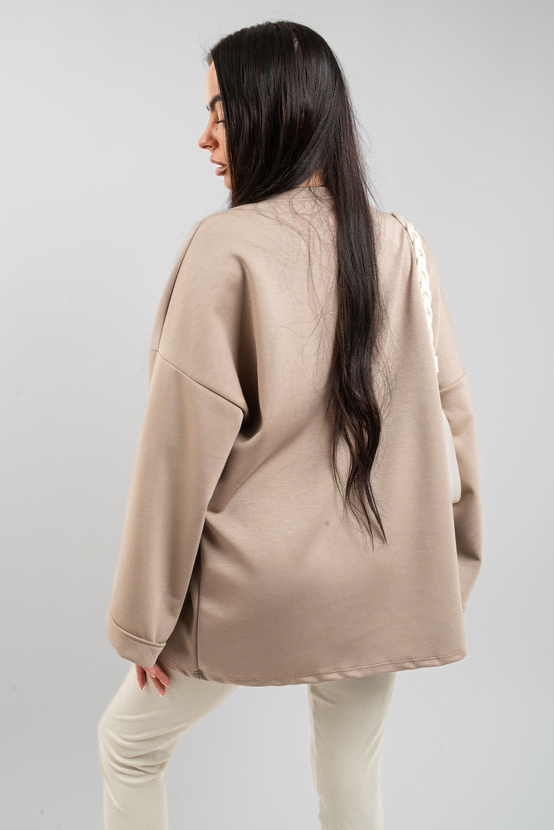 Oversized long-sleeve sweatshirt top, beige, back view with relaxed shoulders.