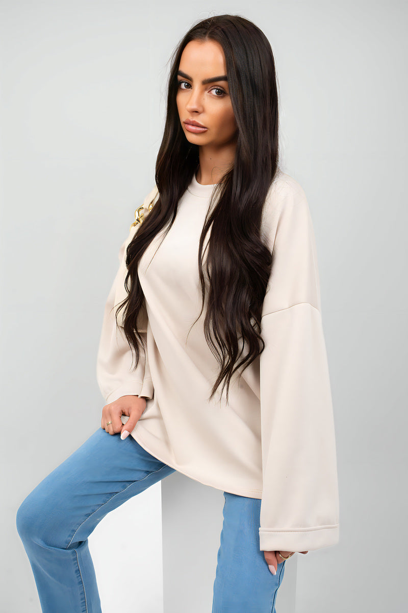 Oversized long-sleeve sweatshirt top, light beige, crew neck with drop-shoulder cut.