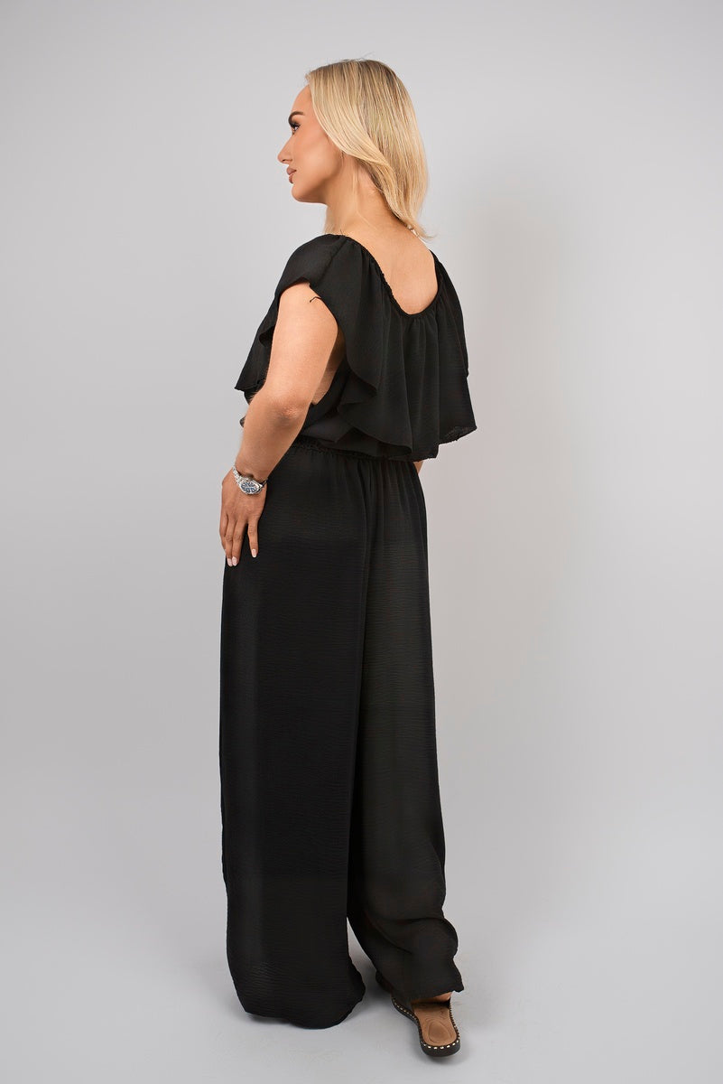 Black off-shoulder wide-leg jumpsuit with short layered ruffle sleeves
