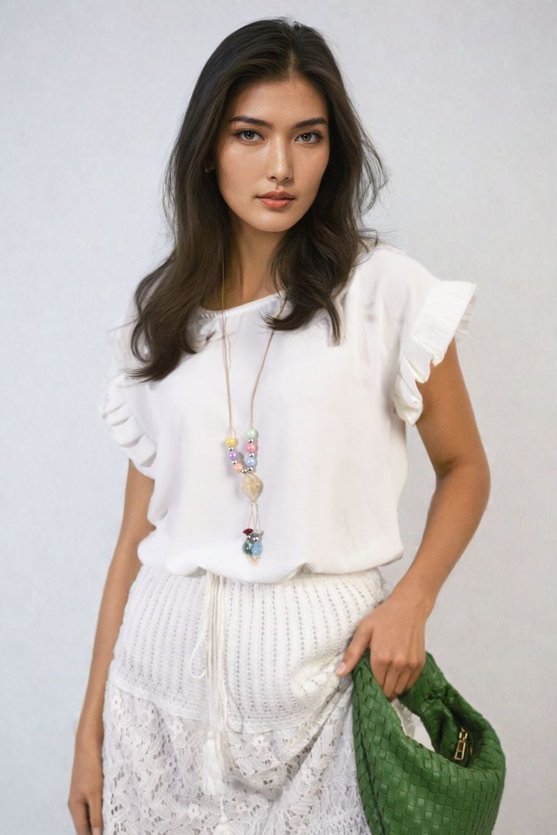 White ruffle-trim sleeve top with round neckline and short layered cuffs