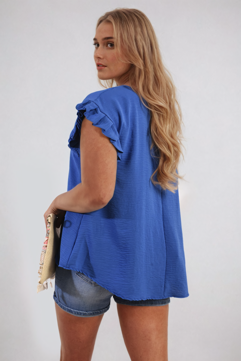 Royal blue ruffle-trim sleeve top with gathered shoulder ruffles and loose hem.