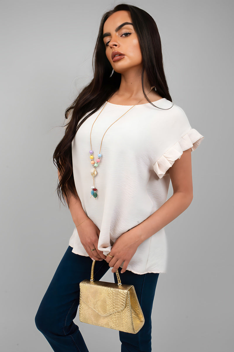 White ruffle trim sleeve top with crew neckline and ruffled cap sleeves
