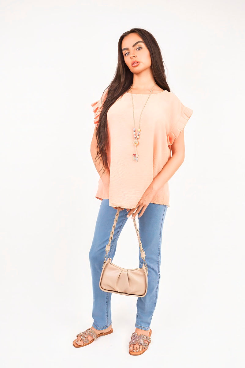 Light pink ruffle-trim sleeve top with flutter sleeves and side drape