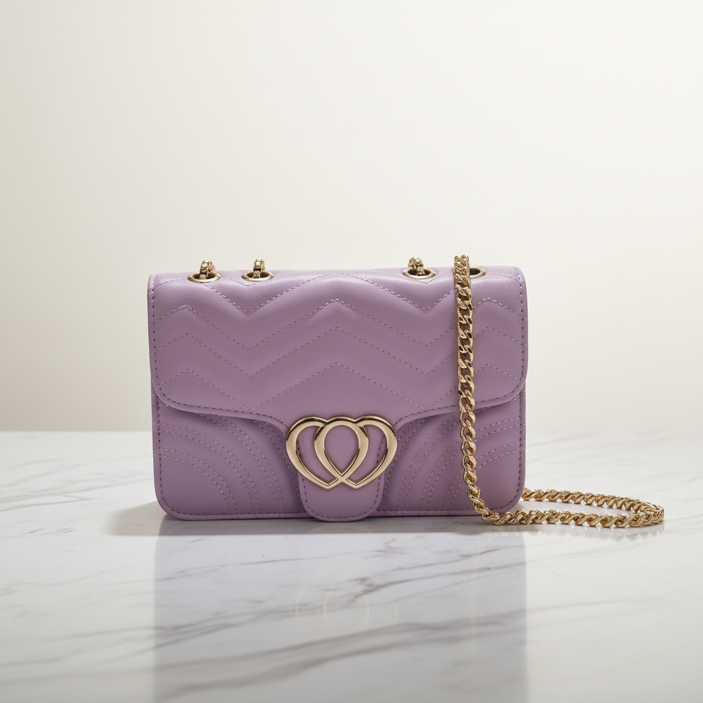 Heart clasp chain shoulder bag in lilac - 45 degree angle with gold chain